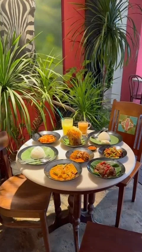 Warung M. Nasir dining table — Nasi Padang spread on banana leaves